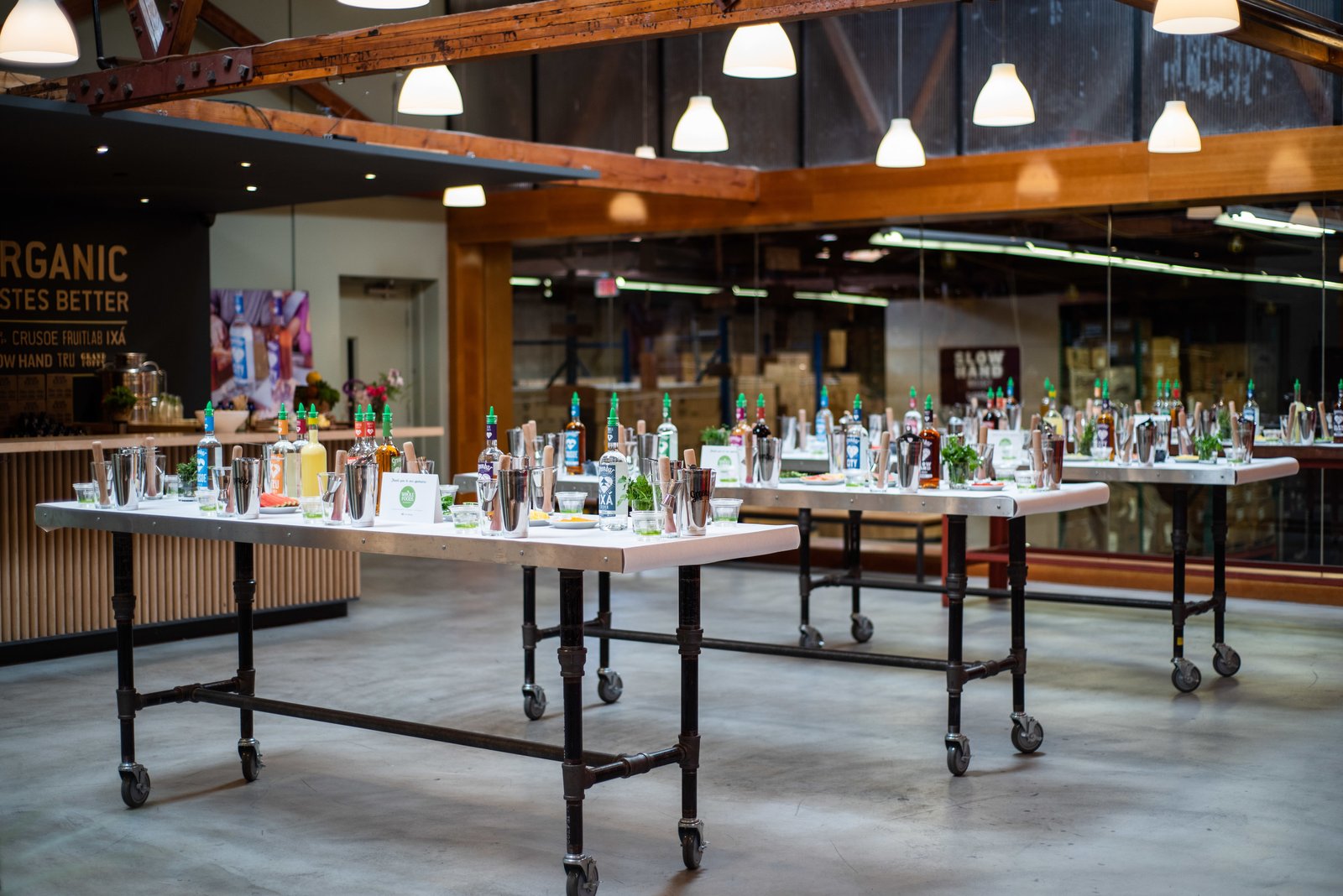 Tables with stations set up for a cocktail class in the Skybox tasting room overlooking the distillery