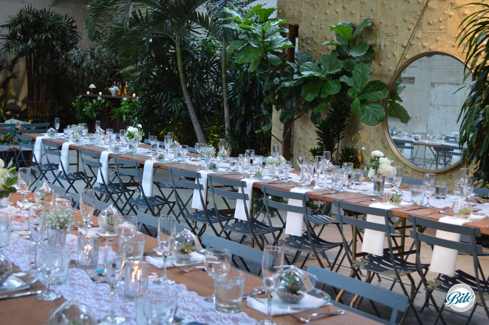 Long tables @ Millwick setup with view of magic garden