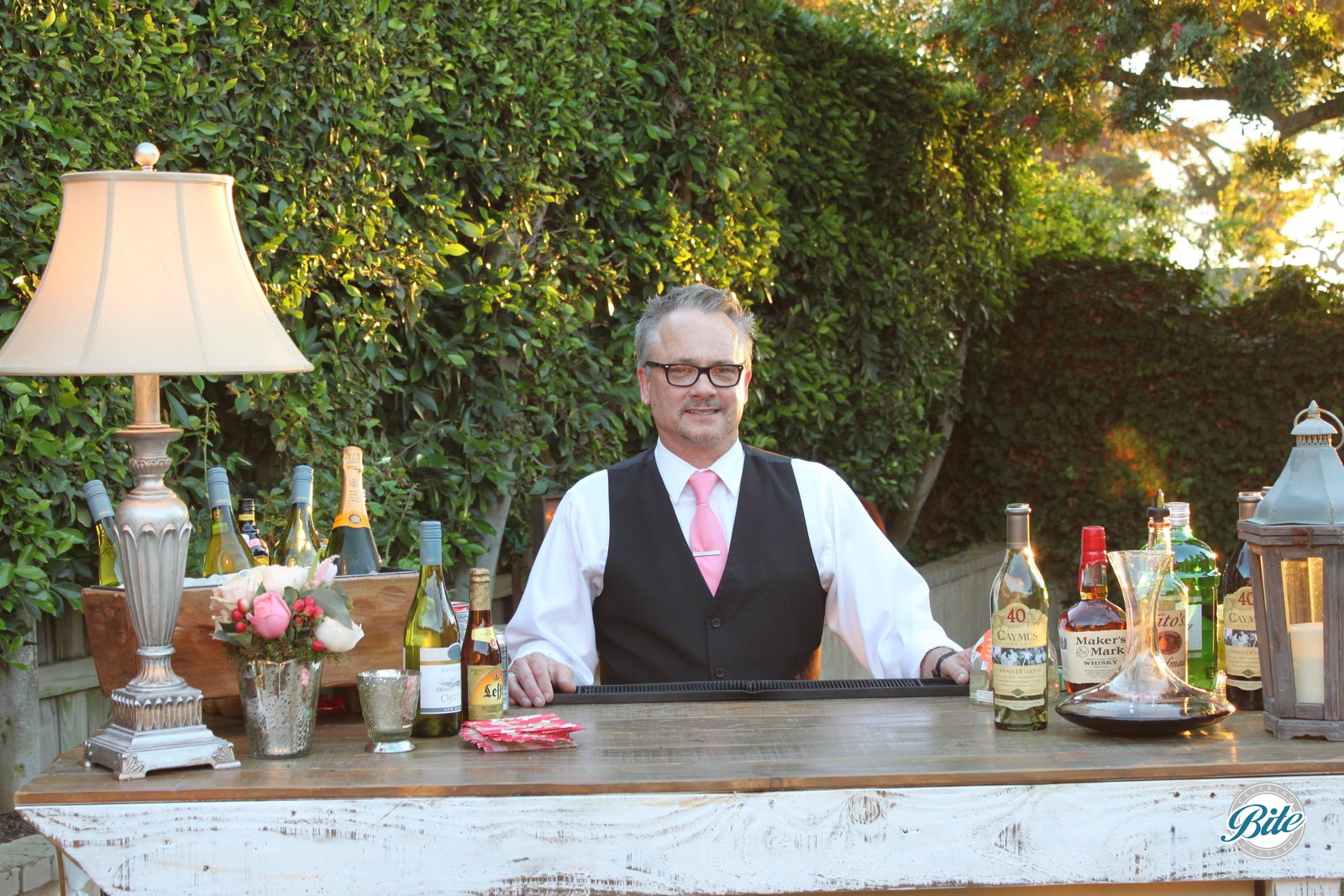 A rustic bar with bartender