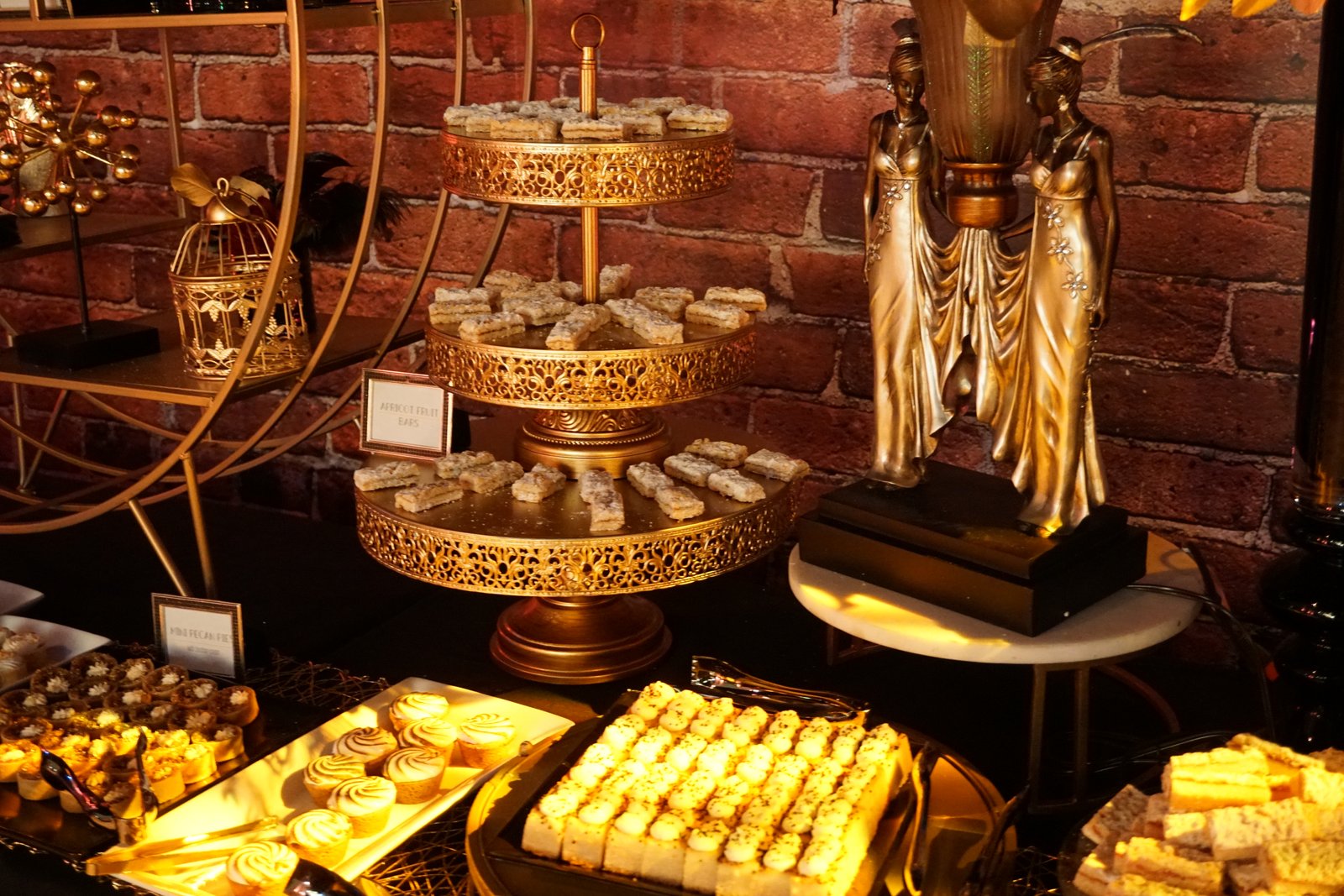 Lavish dessert display with mini pies, mini tarts, and dessert bars