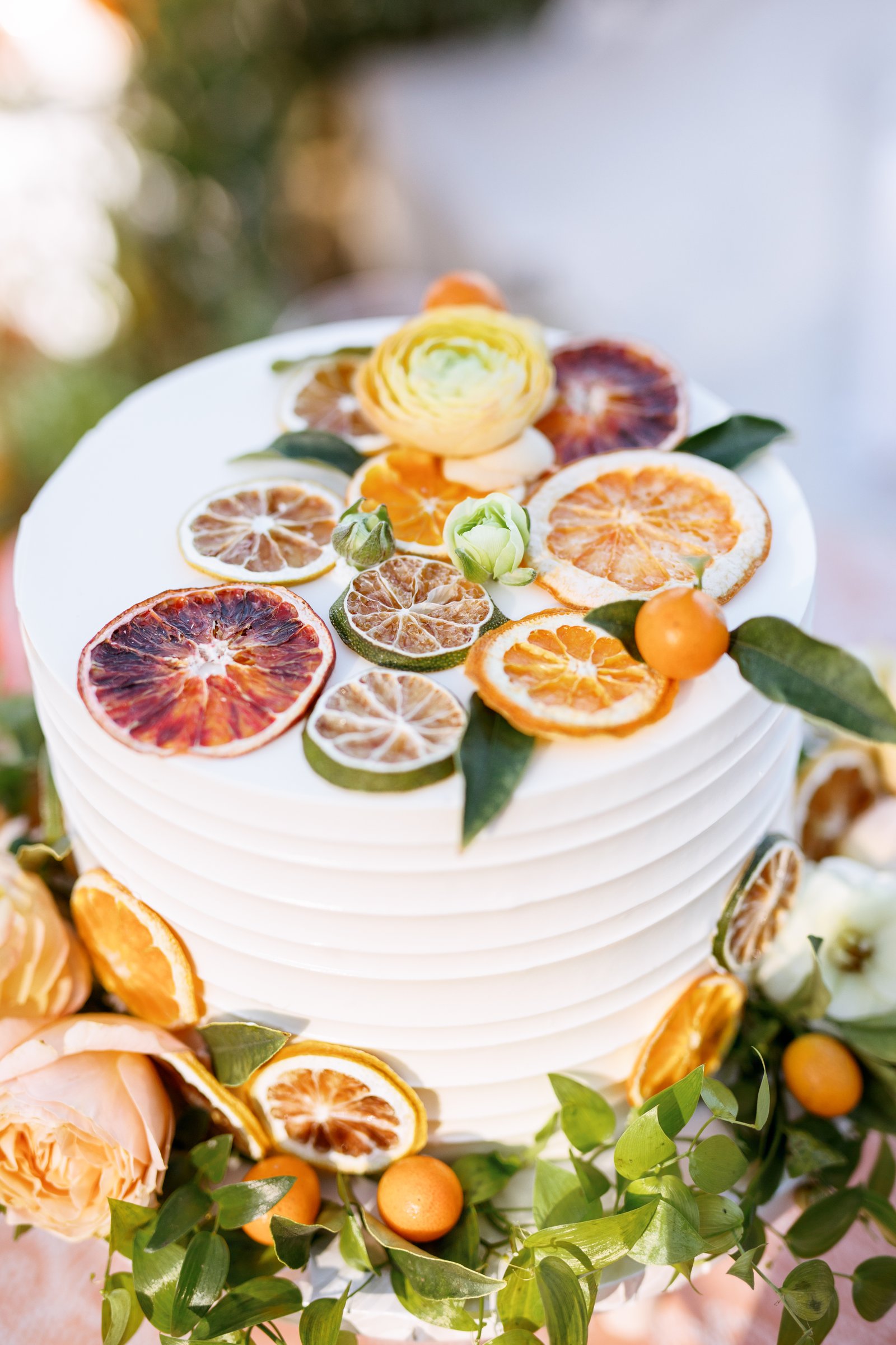 Simply perfect citrus and floral garnished custom wedding cake