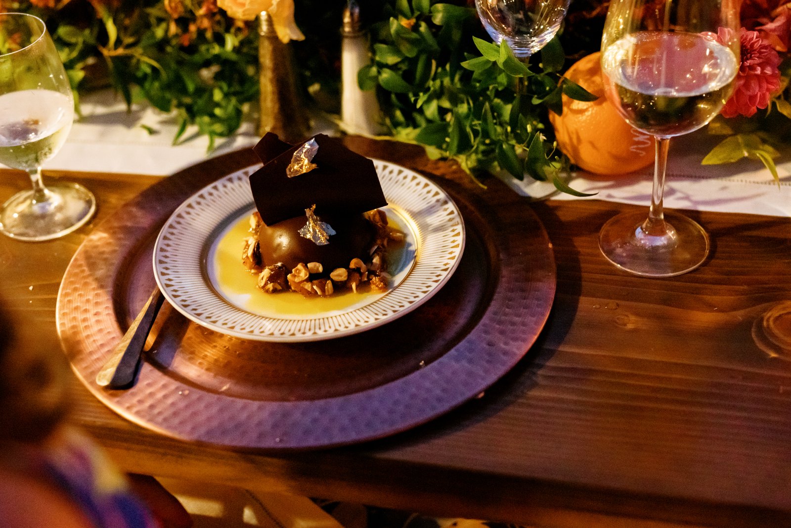  A show stopping chocolate-passionfruit dome dessert fora spectacular micro wedding meal finish