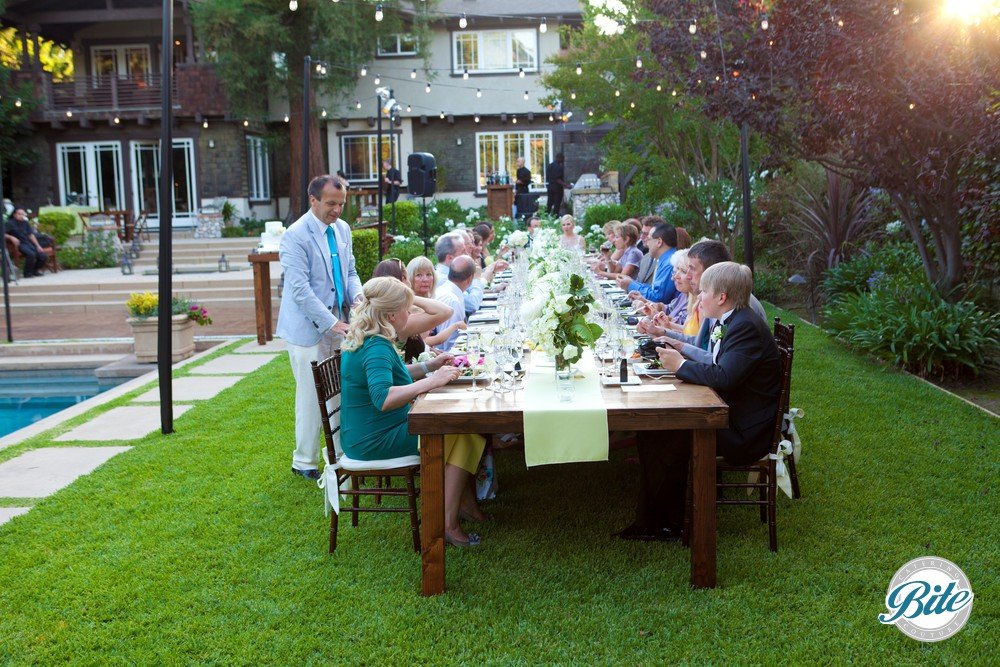 Intimate family-style wedding reception dinner