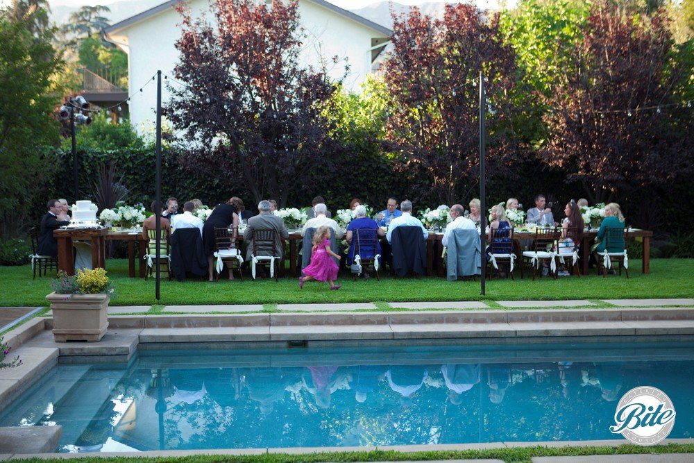 Intimate family-style wedding reception - One long table!