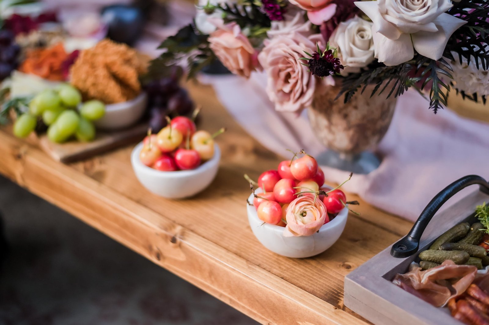 Elegant wedding tablescape with family-style cheese and charcuterie