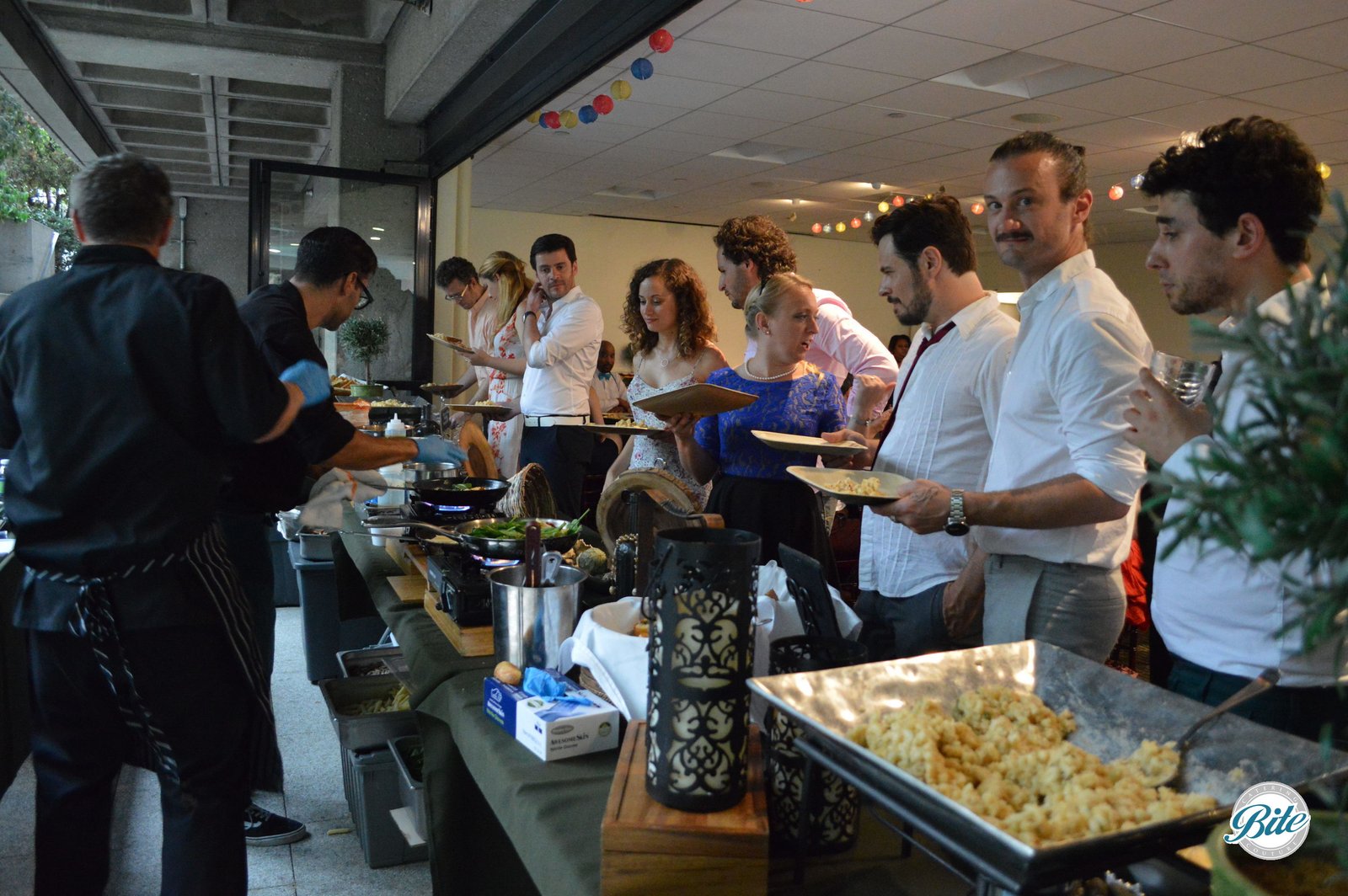 Hungry guests at pasta station